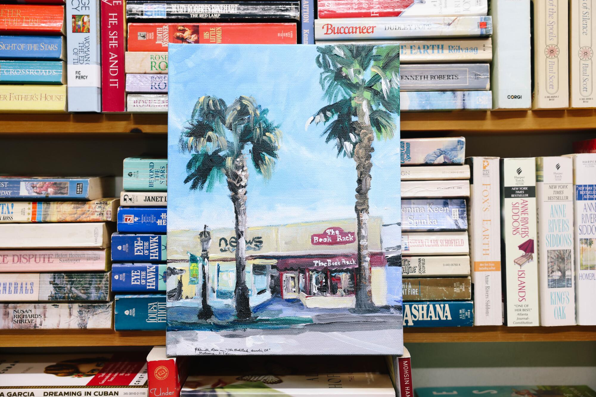 A painting of a storefront and palm trees.