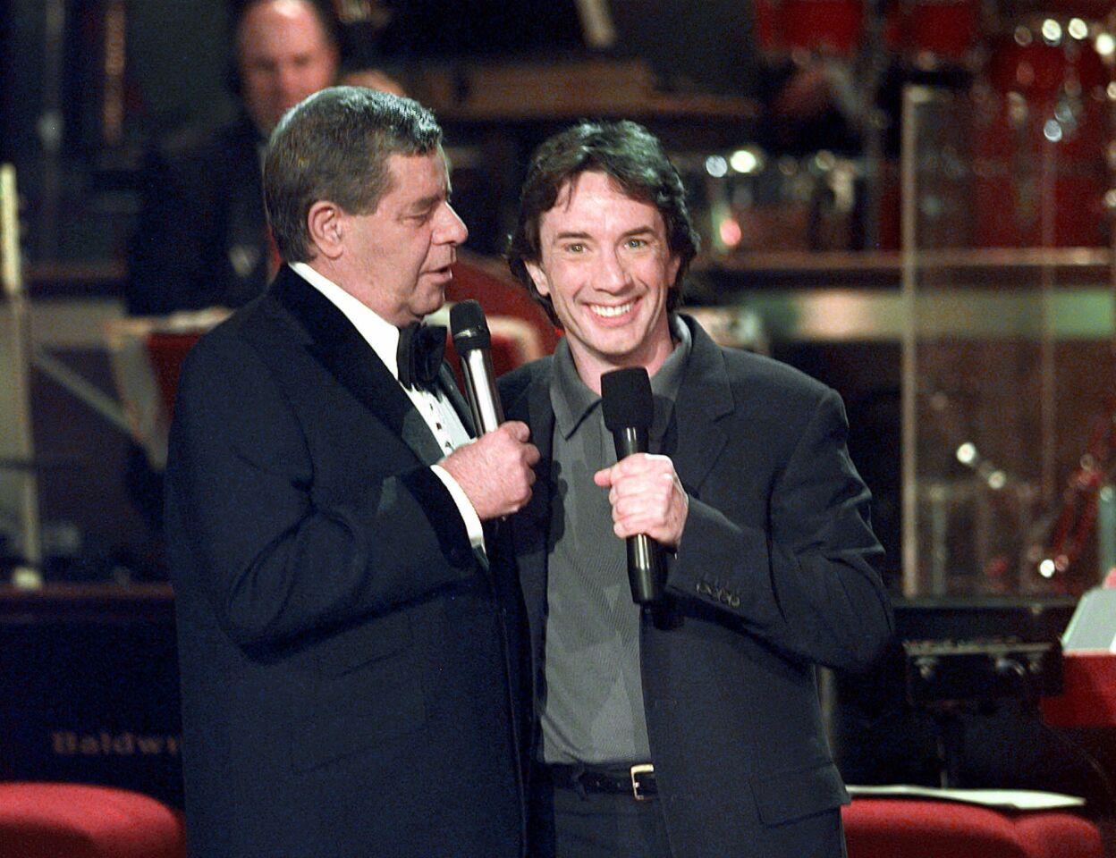 Jerry Lewis and Martin Short perform during the 34th Muscular Dystrophy Assn. Telethon in Los Angeles in 1999.