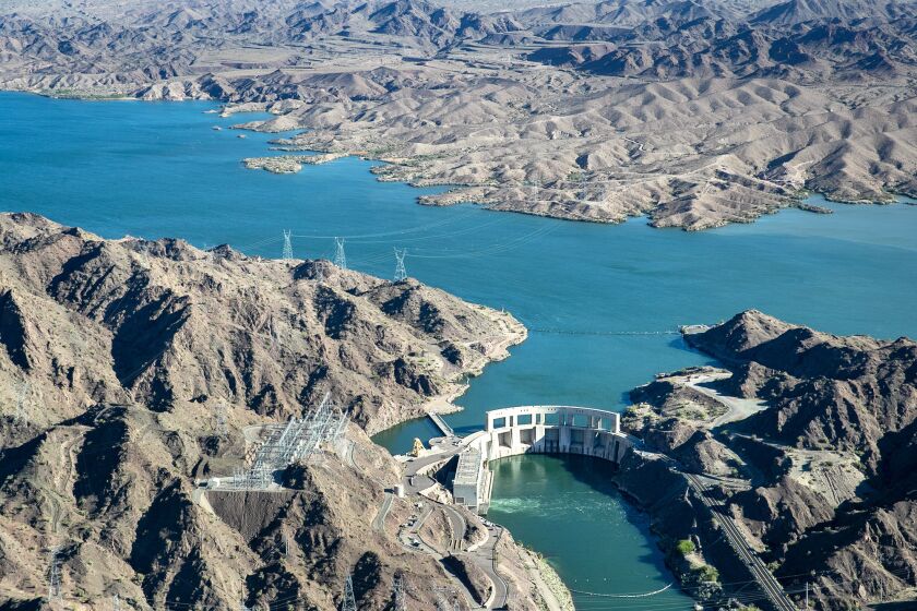LAKE HAVASU, CA - APRIL 04: Parker Dam spans the Colorado River between Arizona and California and creates Lake Havasu on Tuesday, April 4, 2023 in Lake Havasu, CA. Parker Dam provides a reservoir from which water is pumped to the Colorado River Aqueduct. It is also the deepest dam in the world; 73 percent of its structural height of 320 feet is below the original riverbed. (Brian van der Brug / Los Angeles Times)