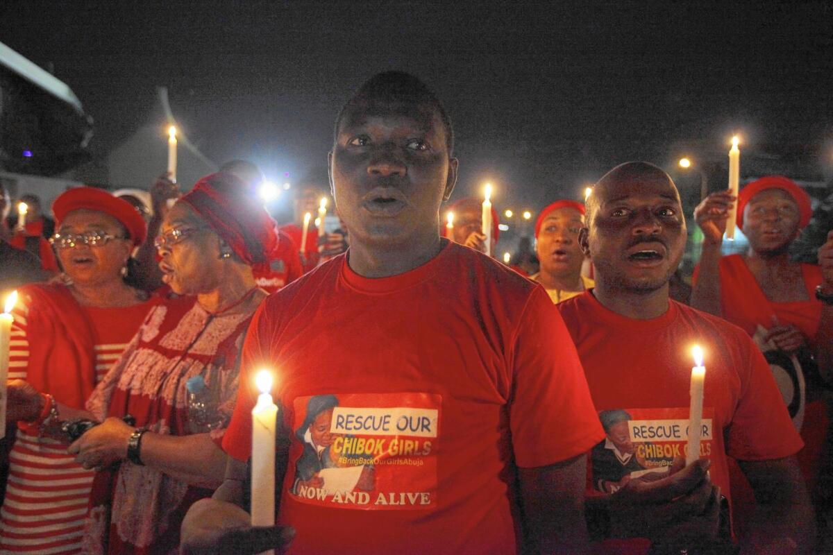 A candlelight vigil marks a month after the militant group Boko Haram's April kidnapping of more than 270 schoolgirls in Chibok, Nigeria.