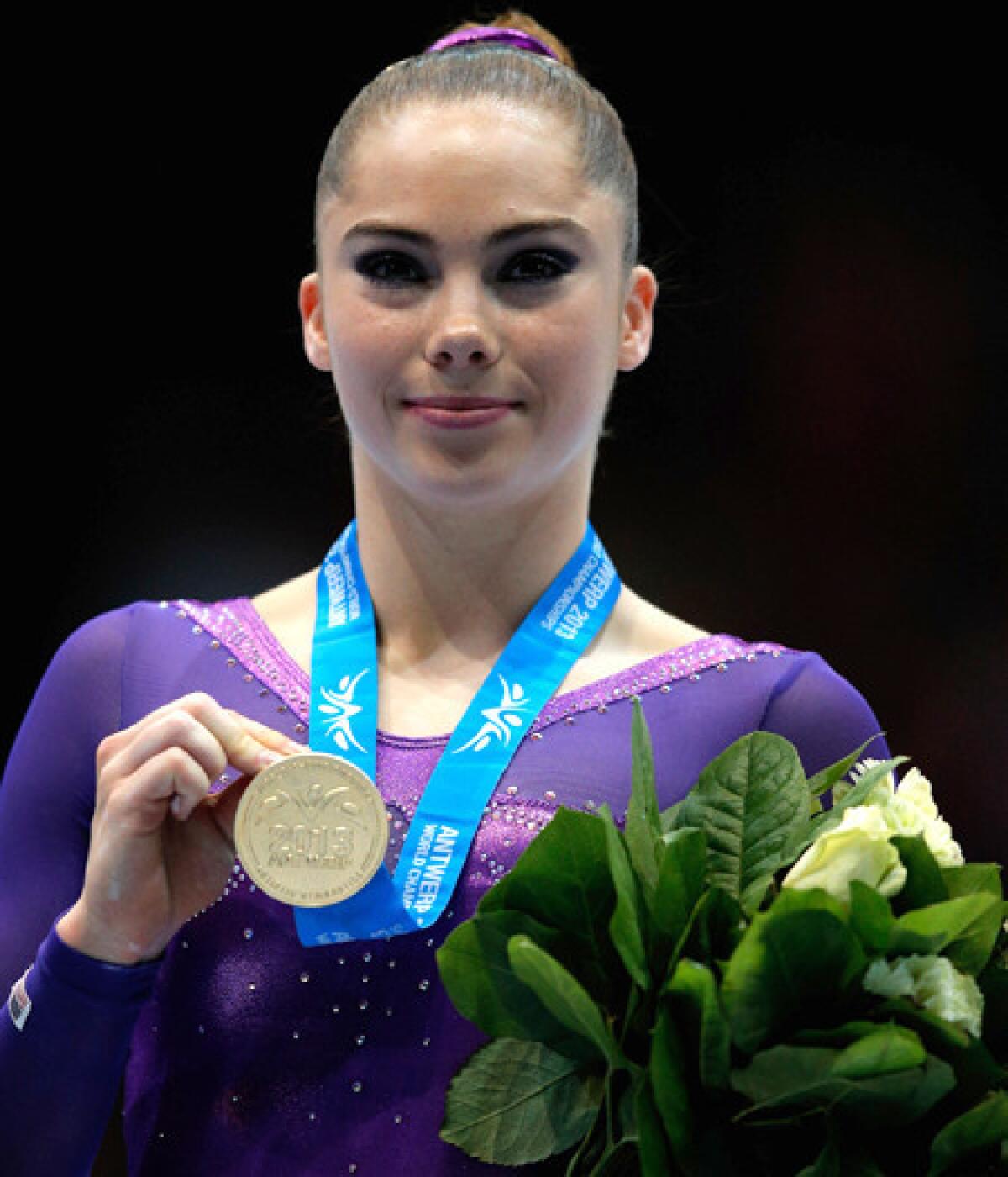 American McKayla Maroney poses with the gold medal after winning the women's vault final at the world championships on Saturday.