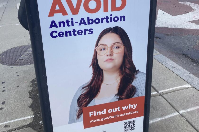 A sign deterring people from going to "anti-abortion centers" is shown in Boston on July 17, 2024. (AP Photo/Steve LeBlanc)