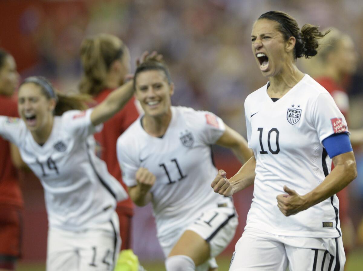 Carli Lloyd celebrates after scoring against Germany on a penalty kick during a semifinal match of the Women's World Cup. The U.S. beat Germany, 2-0.