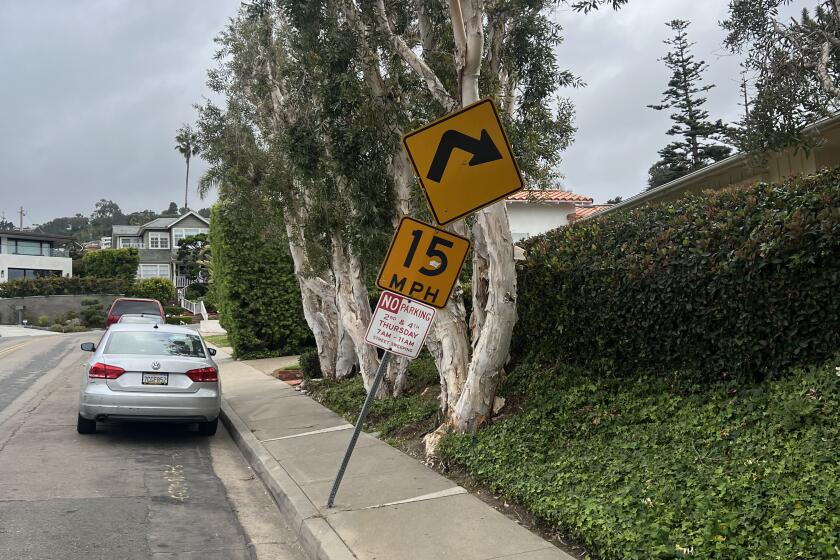 A road sign tilts along Lowry Terrace in La Jolla.