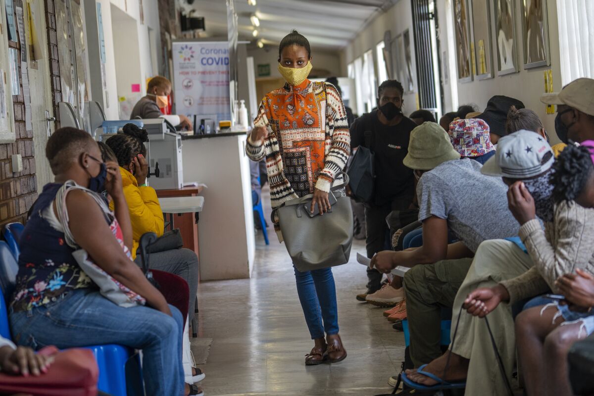 Volunteers in a vaccine trial wait to be checked at a hospital in Soweto, Johannesburg, South Africa. 