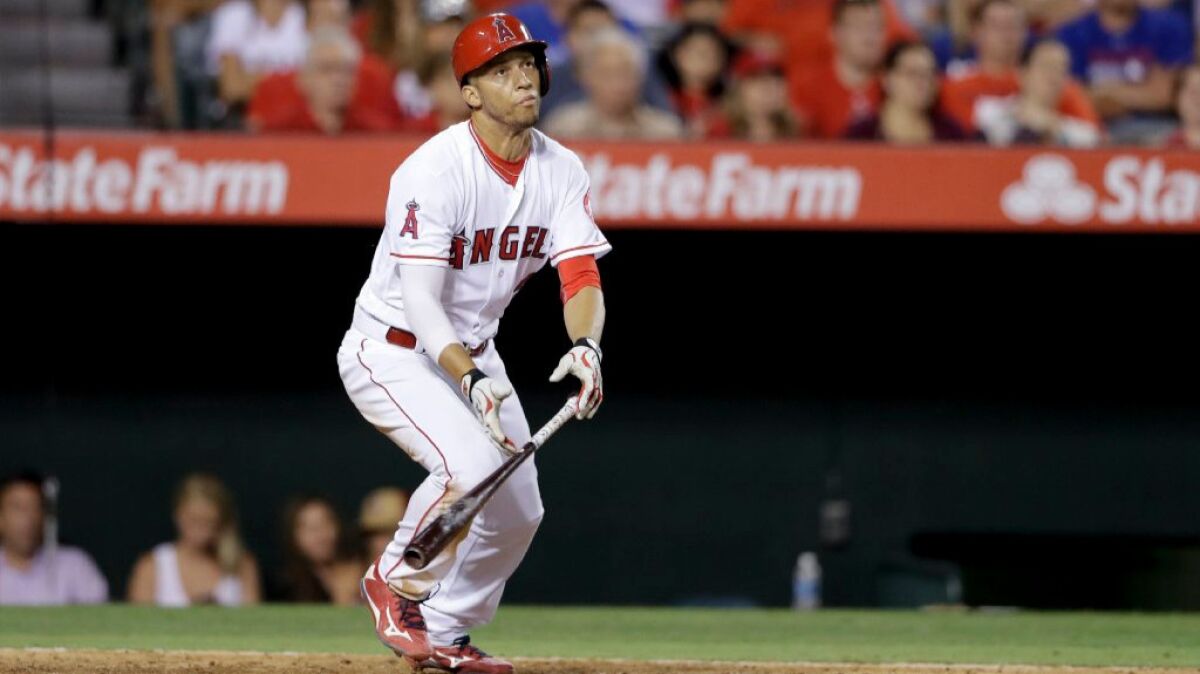 Angels shortstop Andrelton Simmons tracks the flight of a ball during the seventh inning of a game against the Rangers on July 18.