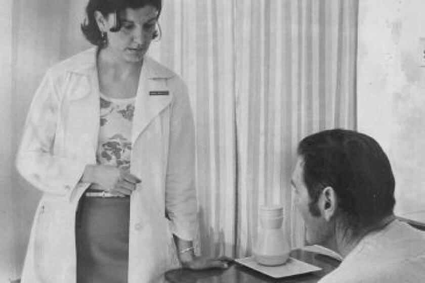 Marion Moses inquires about the health of a patient in 1977 as an intern.