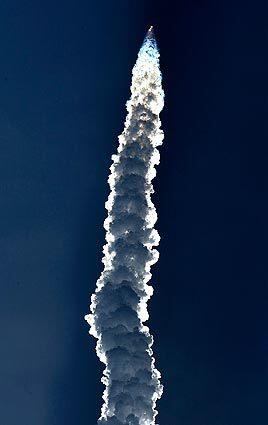 The 235-foot-tall Delta IV Heavy rocket lifts off from Vandenberg Air Force Base. See full story