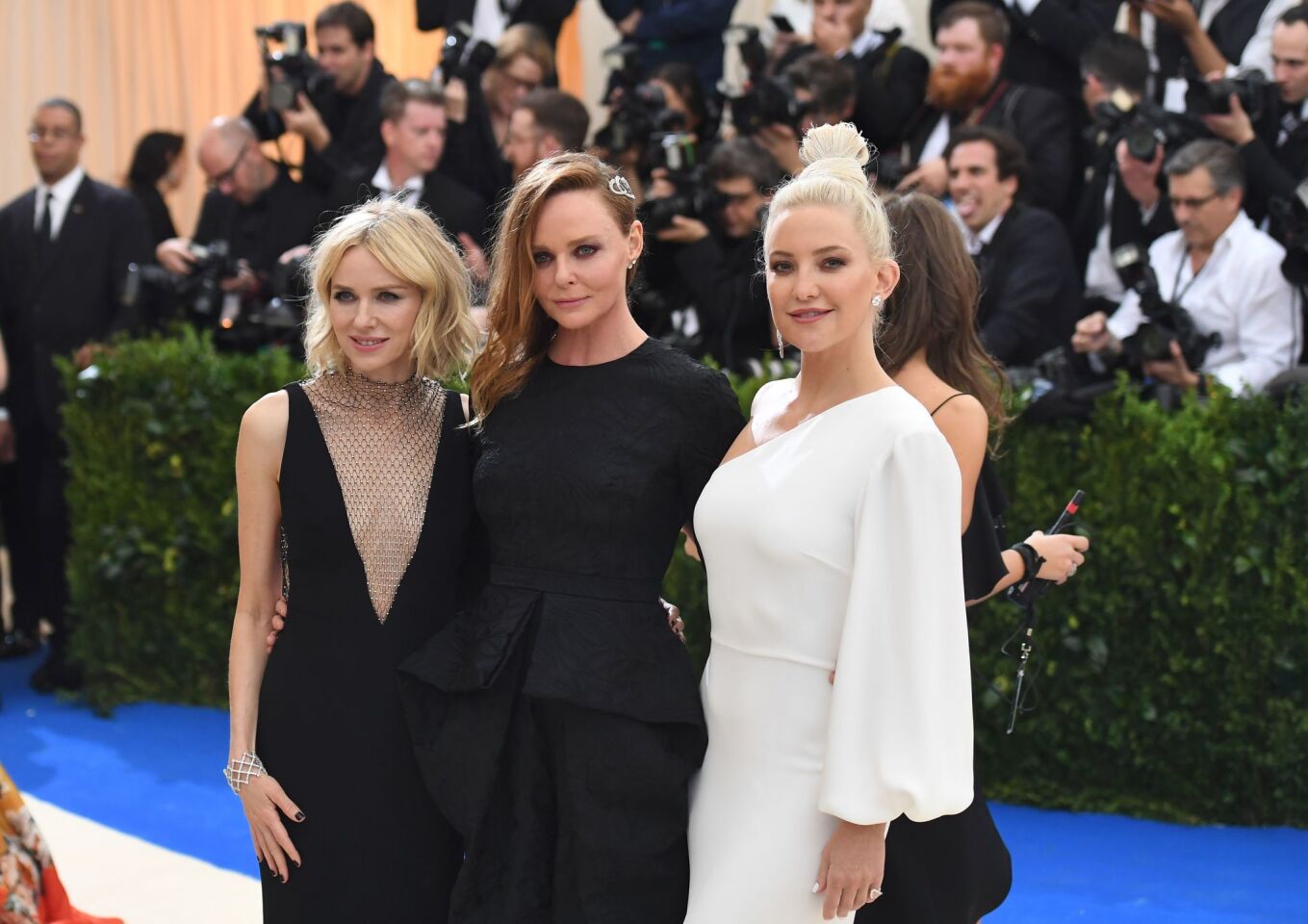 From left, Naomi Watts, Stella McCartney and Kate Hudson attend the Met Gala.