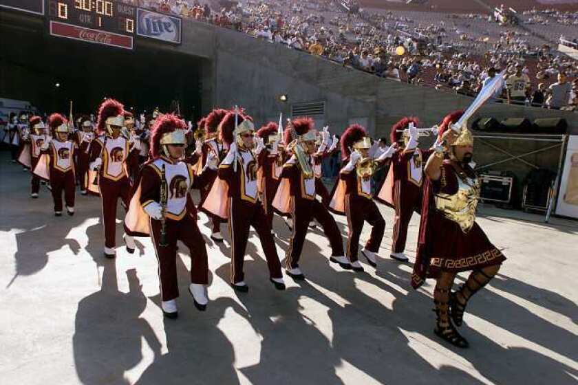 USC's Trojan marching band enter the Coliseum from the players tunnel.
