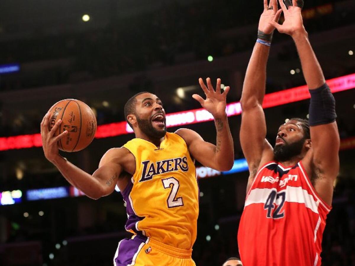 Lakers guard Wayne Ellington goes up for a shot over Wizards center Nene in the first half. Ellington had 20 first-half points.