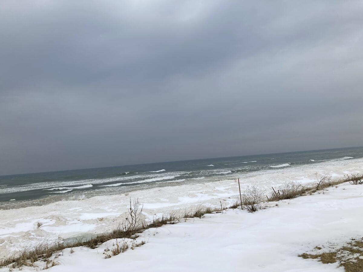 Lake Michigan shoreline in Ottawa County, Mich., with snow on the land.