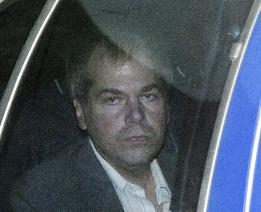 FILE - In this Nov. 18, 2003, file photo, John Hinckley arrives at U.S. District Court in Washington. Lawyers for the man who tried to assassinate President Ronald Reagan say he plans to ask a federal court to allow him to live without conditions in a home with his mother and brother in Virginia. Hinckley’s lawyers stated in a court filing on Thursday April 8, 2021, that he wants to set up a status call as soon as possible in hopes of scheduling a hearing for unconditional release. (AP Photo/Evan Vucci, File)