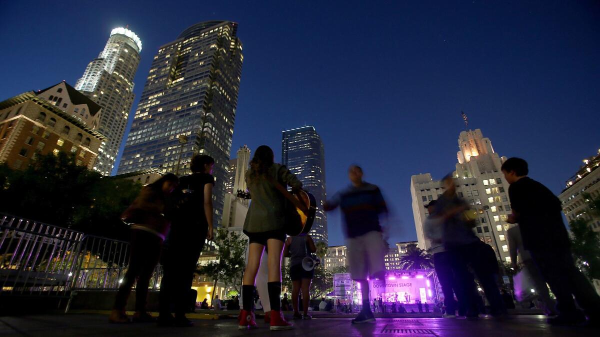 A concert draws a crowd to Pershing Square as dusk descends on Los Angeles in 2014.