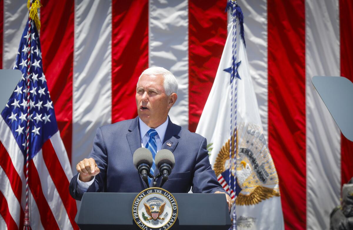Vice President Mike Pence, seen here delivering remarks at Naval Air Station North Island in Coronado on July 11, is scheduled to visit Huntington Beach as part of a two-day trip to California.