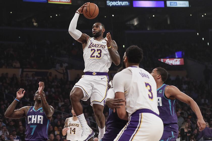 LOS ANGELES, CA, SUNDAY, OCTOBER 27, 2019 - Los Angeles Lakers forward LeBron James (23) drives past Charlotte defenders during second quarter action at Staples Center.(Robert Gauthier/Los Angeles Times)