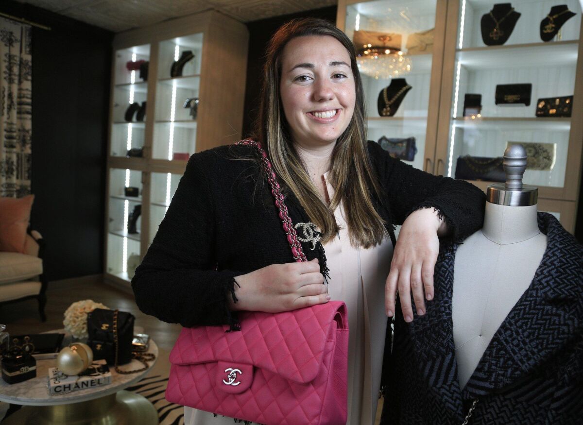 Designer Vault founder Christina Samoylov at her Carlsbad shop, where she sells rare and vintage Chanel bags and jewelry. — David Brooks