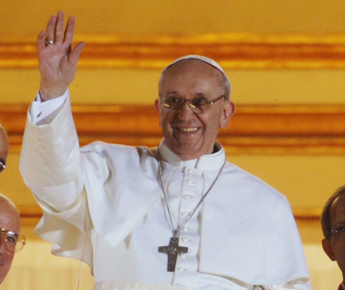 Newly elected Pope Francis I waves to the crowd from the central balcony of St Peter's Basilica on Wednesday in Vatican City. Cardinal Jorge Mario Bergoglio of Argentina was elected as the 266th pontiff and will lead the world's 1.2 billion Roman Catholics.