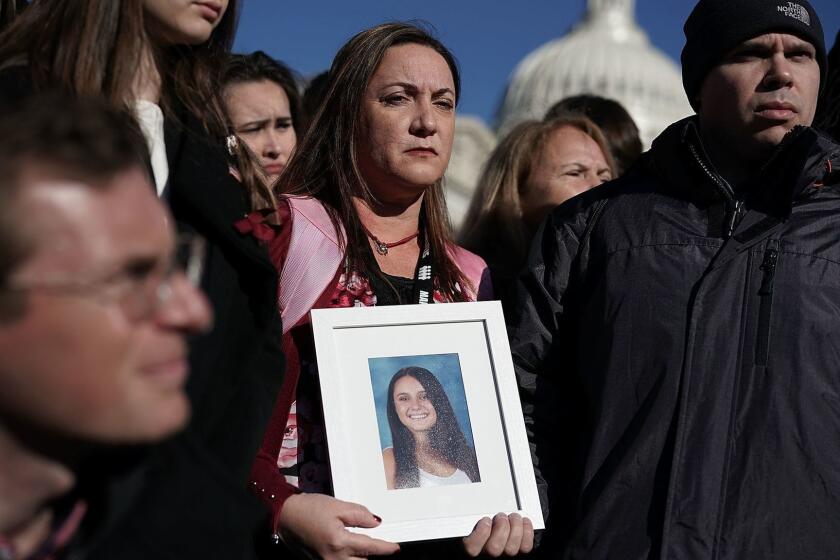 WASHINGTON, DC - MARCH 23: Lori Alhadeff (C) and her husband Ilan Alhadeff (R) hold a picture of their daughter Alyssa Alhadeff, a Marjory Stoneman Douglas High School shooting victim, during a news conference on gun control March 23, 2018 on Capitol Hill in Washington, DC. U.S. Rep. Ted Deutch (D-FL), Sen. Bill Nelson (D-FL) and Sen. Amy Klobuchar (D-MN), joined by students and gun control advocates, held a news conference "to demand action on gun safety." (Photo by Alex Wong/Getty Images) *** BESTPIX *** ** OUTS - ELSENT, FPG, CM - OUTS * NM, PH, VA if sourced by CT, LA or MoD **