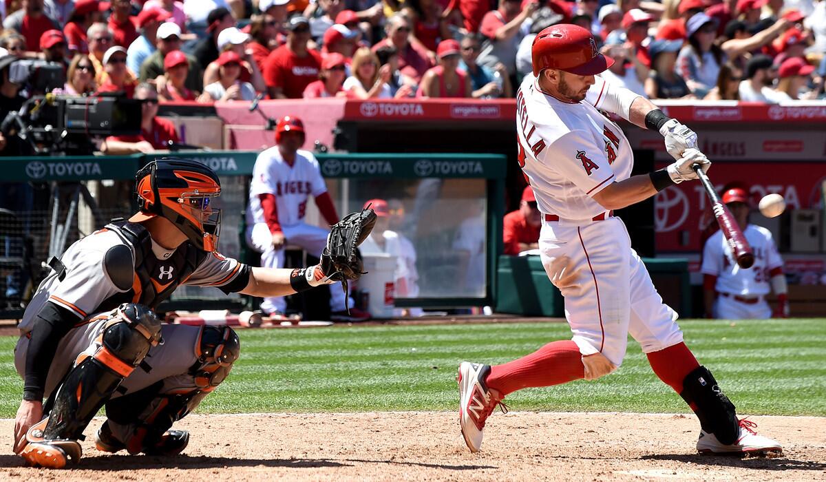 Angels' Johnny Giavotella hits an RBI single in the seventh inning against the Baltimore Orioles at Angel Stadium on Sunday.