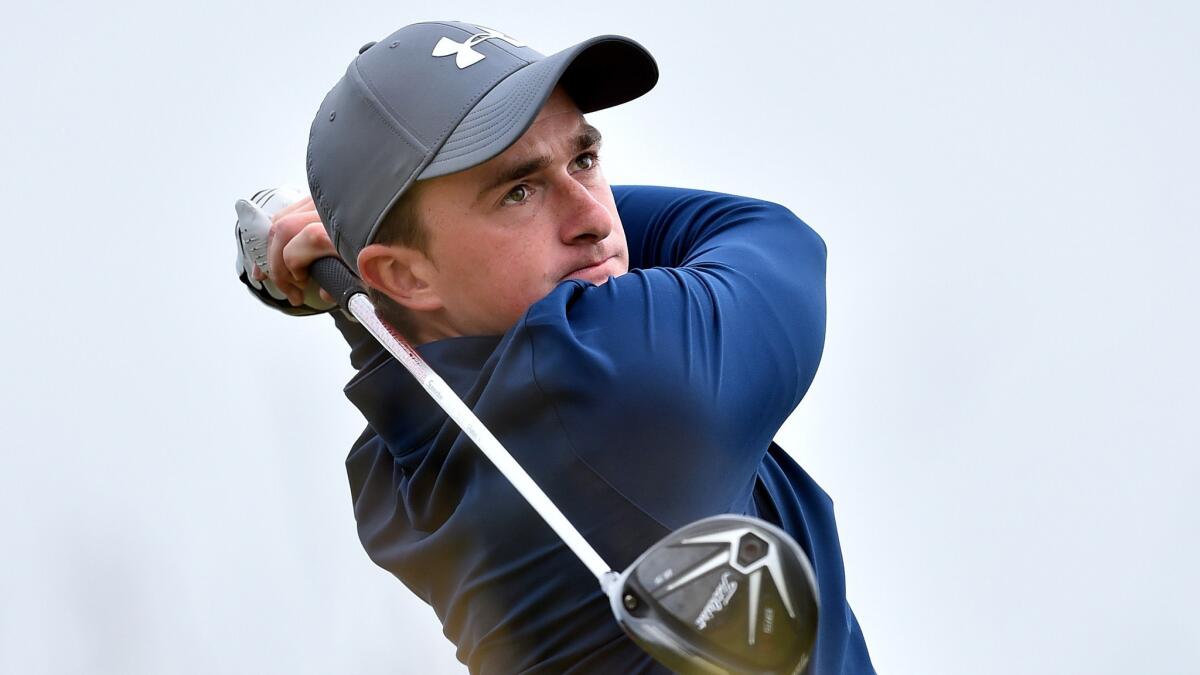 Amateur Paul Dunne of Ireland watches his drive from the sixth tee during the third round of the British Open at St. Andrews, Scotland, on Sunday.