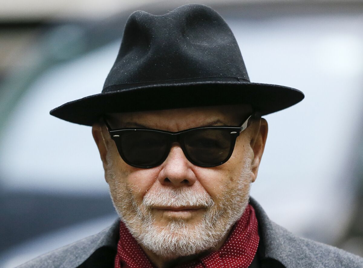 FILE - British pop star Gary Glitter, whose real name is Paul Gadd, arrives at Southwark Crown Court in London, on Feb. 4, 2015. Former pop star Gary Glitter was released from prison in England on Friday Feb. 3, 2023 after serving half of a 16-year prison sentence for sexually abusing three young girls in the 1970s. (AP Photo/Kirsty Wigglesworth, File)