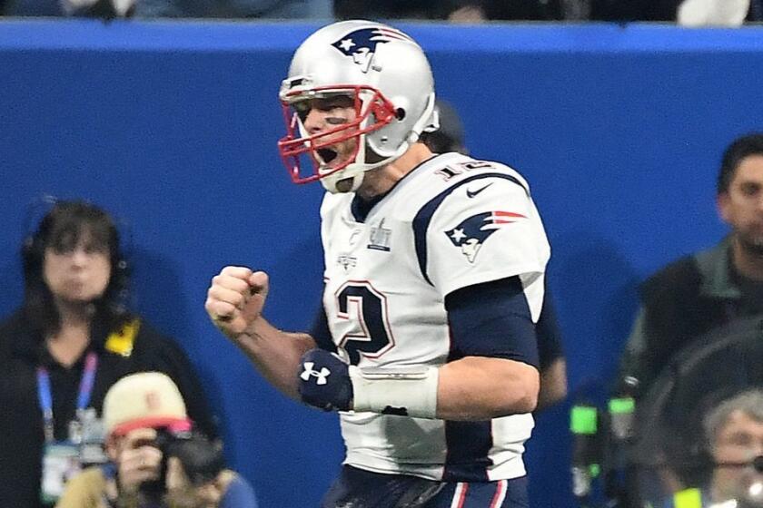 ATLANTA, GEORGIA FEBRUARY 3,2019-PAtriots quarterback Tom Brady celebrates a touchdown by Sony Michel against the Rams inthe 4th quarter in Super Bowl LIII at Mercedes Benz Satdium in Atlanta Sunday.(Wally Skalij/Los Angeles Times)