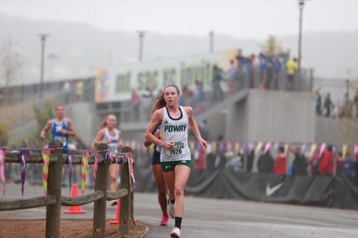 Tessa Buswell, shown running track last year, is one of the top cross country athletes in San Diego.