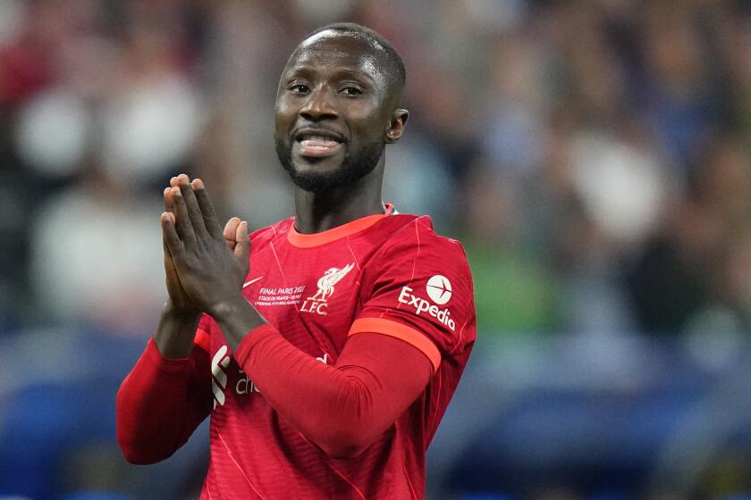 FILE - Liverpool's the player Naby Keita reacts during the Champions League final soccer match between Liverpool and Real Madrid at the Stade de France in Saint Denis near Paris, May 28, 2022. German Bundesliga club Werder Bremen has suspended midfielder Naby Keita for the rest of the season because he skipped the team’s last Bundesliga match. Bremen says it also gave Keita “a substantial fine” and that he will no longer train with the team. (AP Photo/Petr David Josek, file)