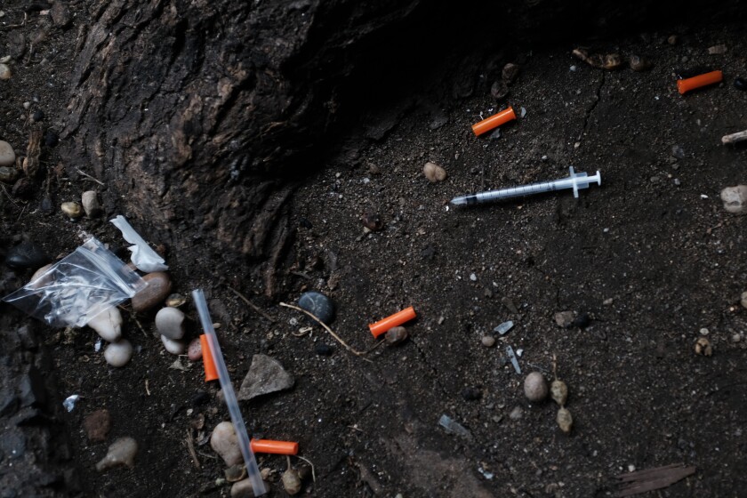 Hypodermic needles litter the ground in the South Bronx  in New York City. 