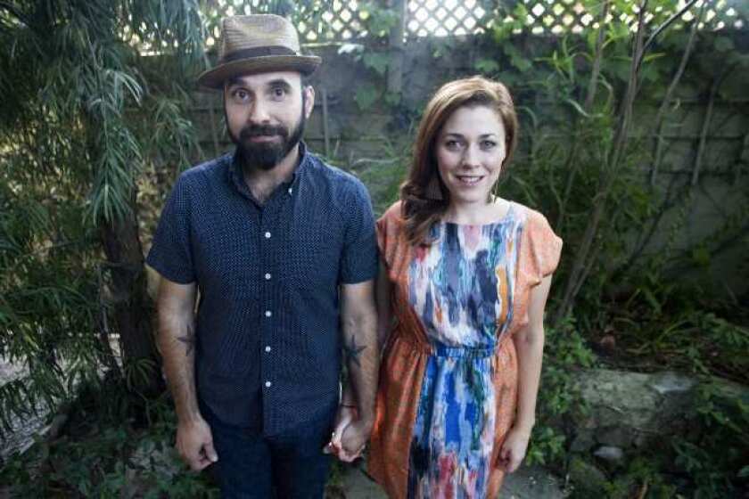 Lucky Diaz, left, and his wife, Alisha, at their home in Los Angeles. Lucky and Alisha started the Lucky Diaz and the Family Jam Band three years ago. "It's such a joyous experience," Alisha says. "It gave us the opportunity to travel and meet so many different families," she adds.