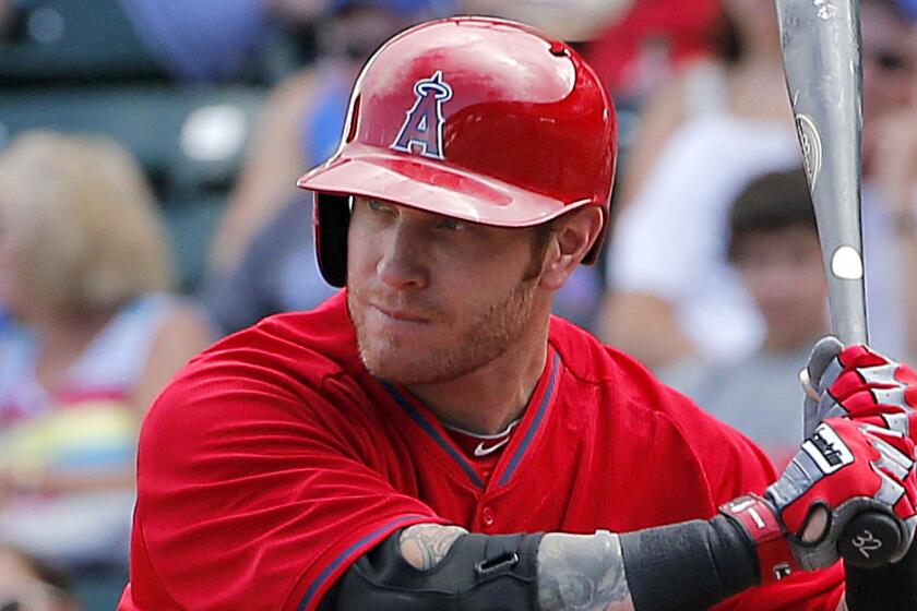 Angels outfielder Josh Hamilton takes a high fastball during a March 2014 exhibition game against the Chicago Cubs in Mesa, Ariz.