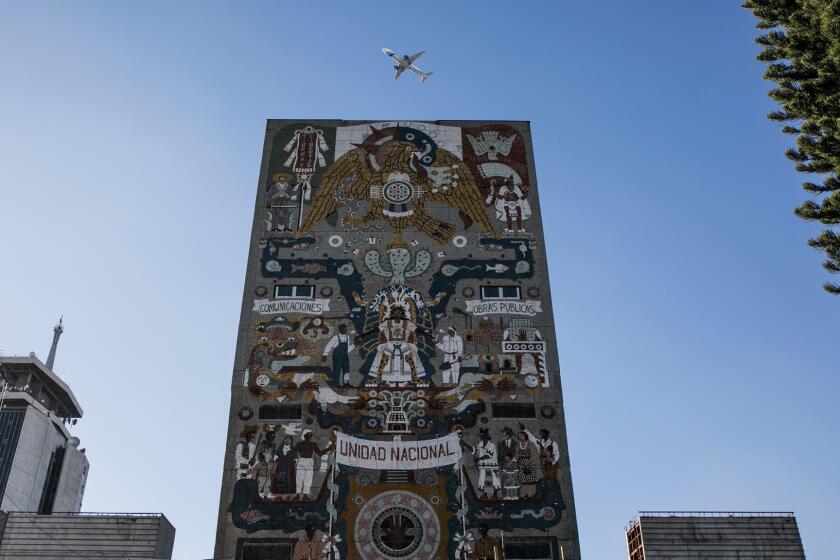 MEXICO CITY, FEDERAL DISTRICT -- MONDAY, DECEMBER 17, 2018: A view of the Centro SCOP murals at the abandoned headquarters of the Secretariat of Communications and Transportation after it was damaged twice in separate earthquakes, the most recent one in 2017, in Mexico City, on Dec. 17, 2018. (Marcus Yam / Los Angeles Times)