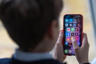 BATH, UNITED KINGDOM - FEBRUARY 25: In this photo illustration a a 12-year-old school boy looks at a iPhone screen A 12-year-old boy looks at an iPhone screen showing various social media apps including TikTok, Facebook and X on February 25, 2024 in Bath, England. This week the UK government issued new guidance backing headteachers in prohibiting the use of mobile phones throughout the school day, including at break times. Many schools around the country are already prohibiting mobile phone use over concerns. The amount of time children spend on screens each day rocketed during the Covid pandemic by more than 50 per cent, the equivalent of an extra hour and twenty minutes. Researchers say that unmoderated screen time can have long-lasting effects on a child's mental and physical health. Recently TikTok announced that every account belonging to a user below age 18 have a 60-minute daily screen time limit automatically set. (Photo by Matt Cardy/Getty Images)