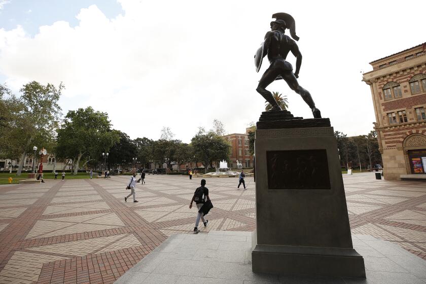 LOS ANGELES, CA - MARCH 10, 2020 Tommy Trojan stands guard over a quiet University of Southern California USC campus near downtown Los Angeles on Wednesday as classes are being held online for the first day. (Al Seib / Los Angeles Times)