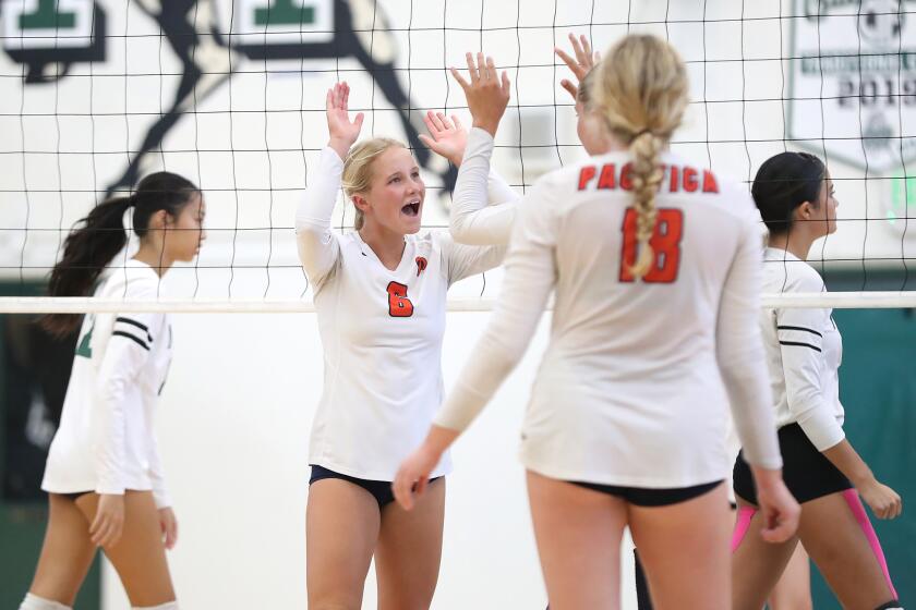 Pacifica Christian's Sierra Leeper (6) celebrates a point with teammates.