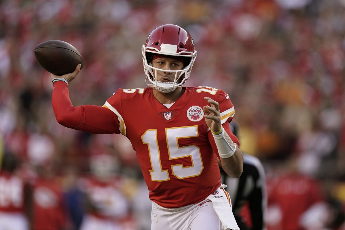 Kansas City Chiefs quarterback Patrick Mahomes throws during the first half of an NFL football game against the Green Bay Packers Sunday, Nov. 7, 2021, in Kansas City, Mo. (AP Photo/Charlie Riedel)