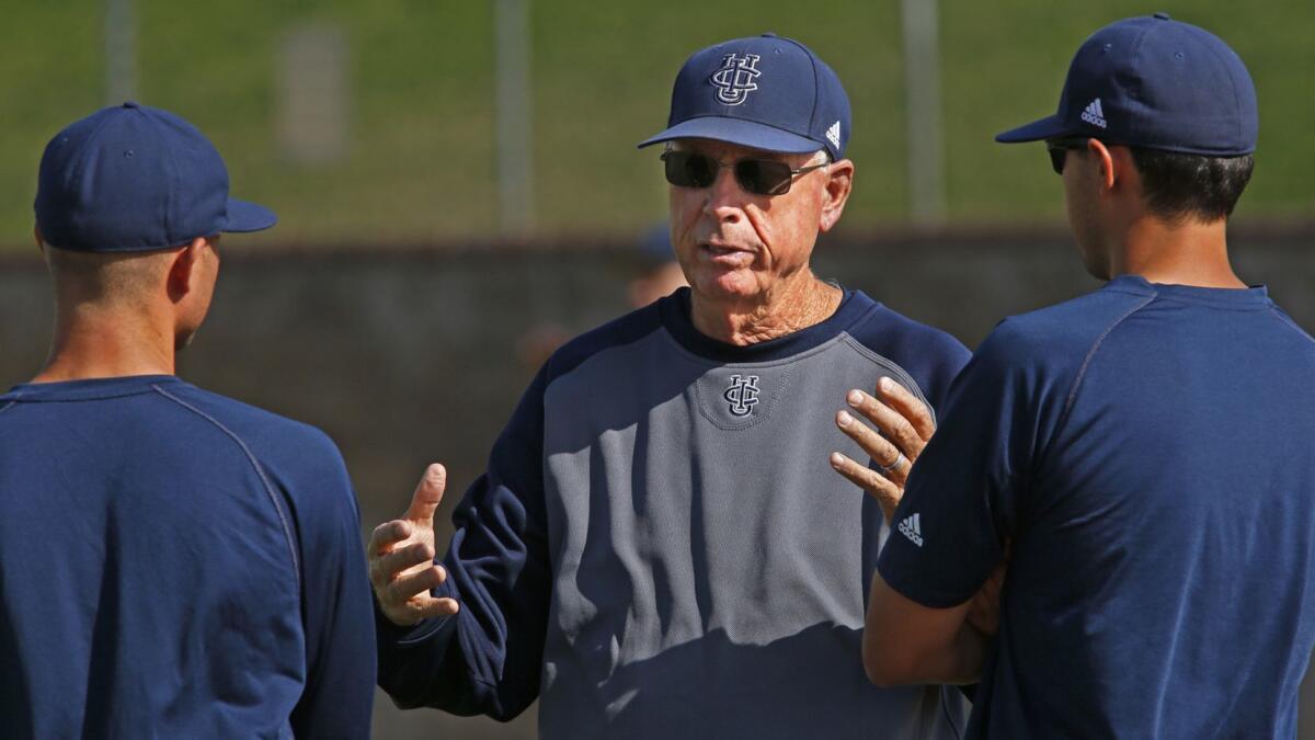 Coach Mike Gillespie, center, talks with assistants Ben Orloff, left, and Eric Deragisch during a UC Irvine practice in 2014.