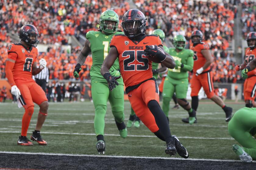 Oregon State running back Isaiah Newell (25) scores a touchdown against Oregon on Nov. 26, 2022, in Corvallis, Ore.