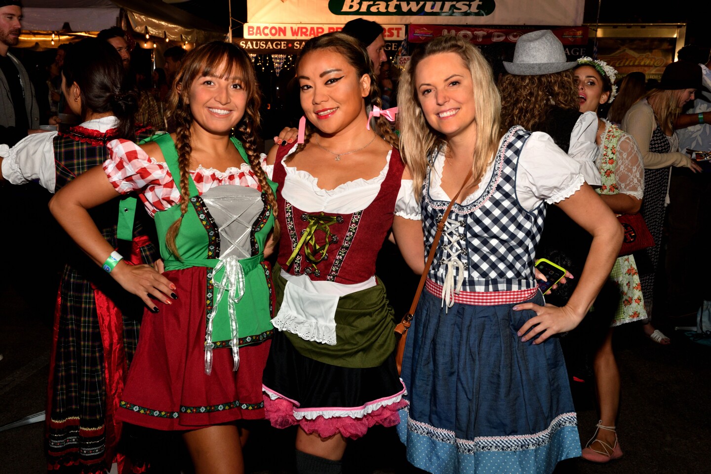 Marjon Farzadpour, Shusin Cheng and Nicole Collins are dressed the part for opening night of Ocean Beach Oktoberfest.