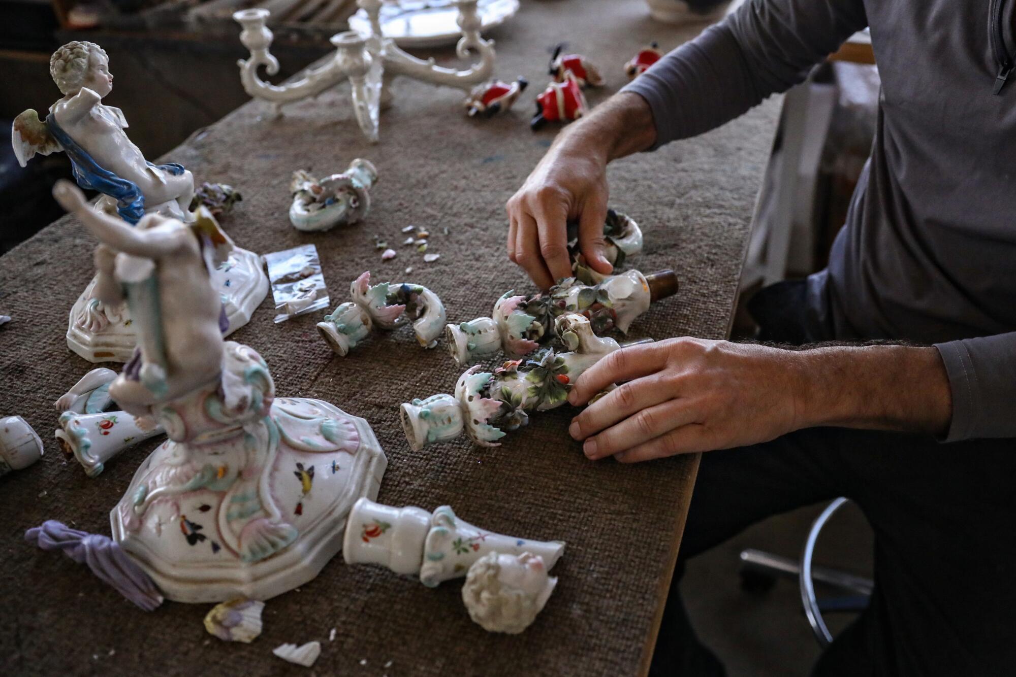 Broken porcelain on a work table.