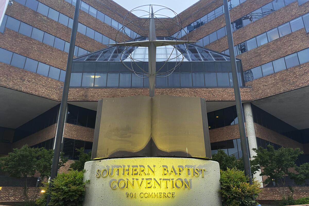 A cross and Bible sculpture stand outside the Southern Baptist Convention headquarters in Nashville.