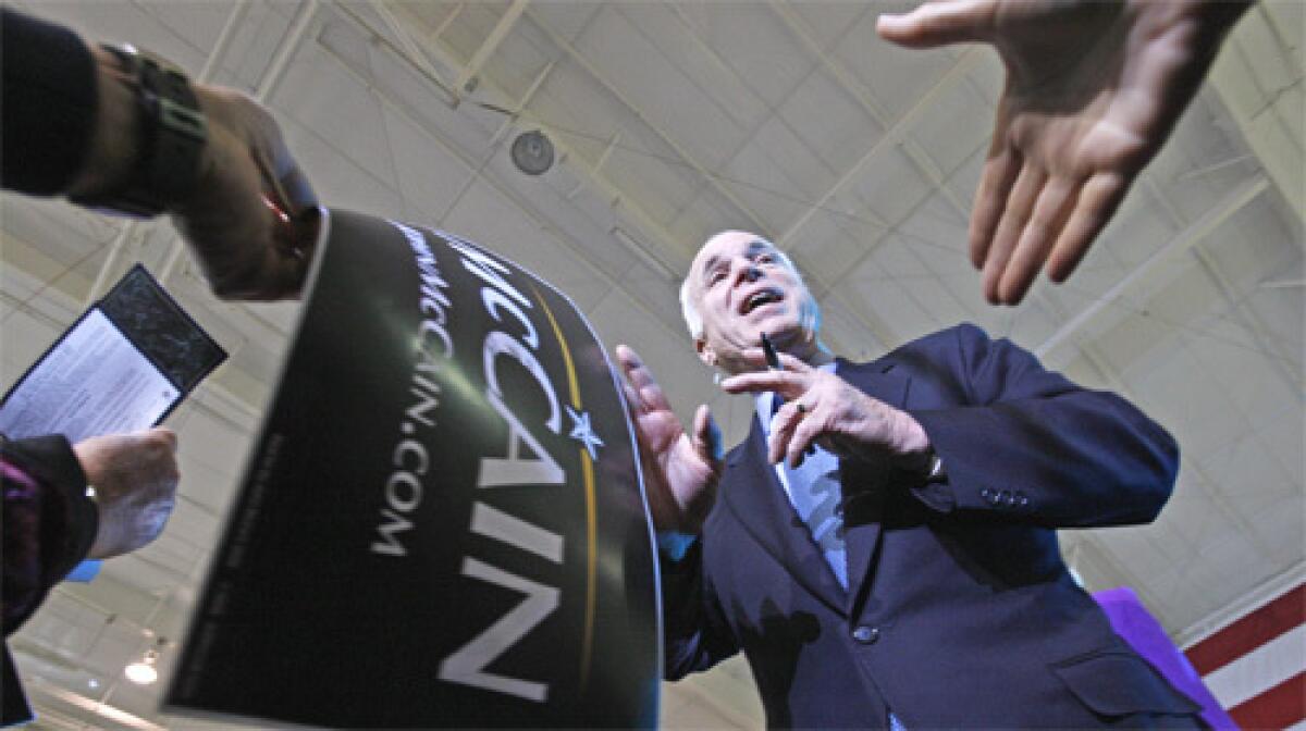 Republican presidential hopeful, Sen. John McCain, R-Ariz., is greeted by supporters at a campaign event in Orlando, Fla.