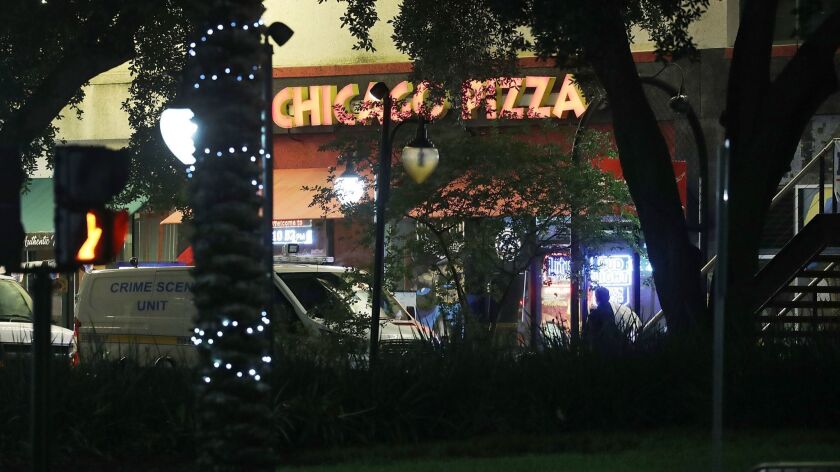 Police investigate a shooting at a gaming tournament in Jacksonville, Fla., on Sunday.