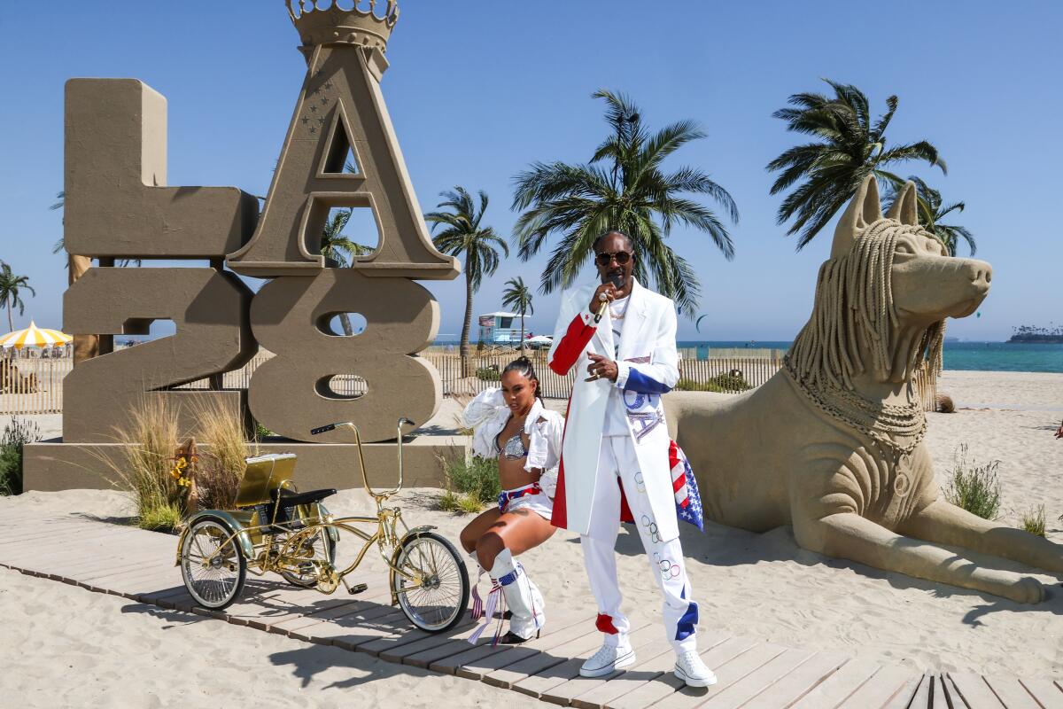 Snoop Dogg performs at Rosie's dog beach in Long Beach for the Olympics closing ceremony.