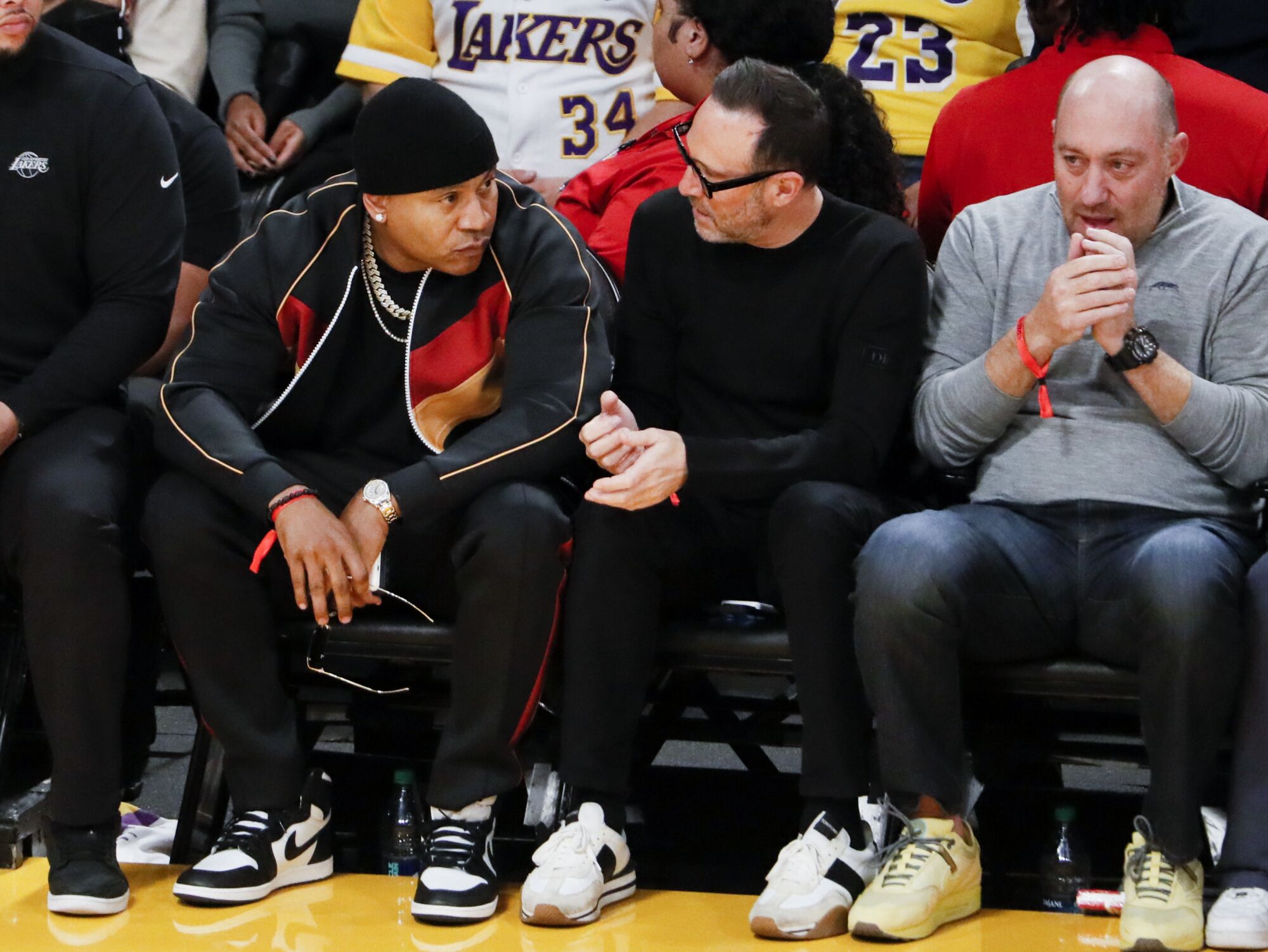 Musician LL Cool J watches the game during the first quarter.