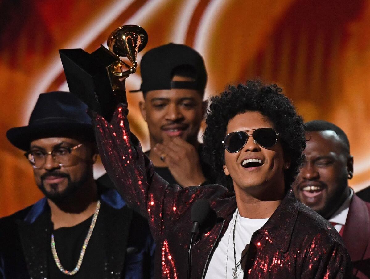 Bruno Mars wins album of the year at the 60th Grammy Awards.