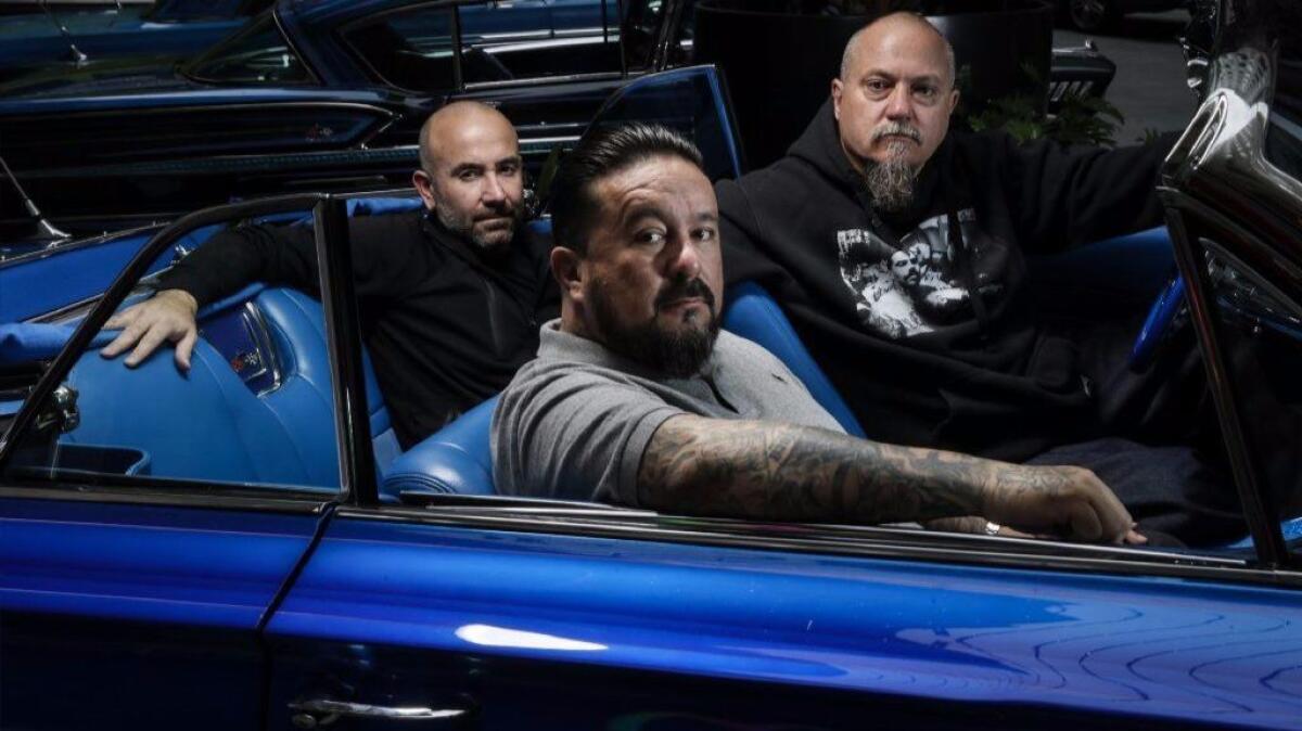 Mister Cartoon, center, is flanked by Estevan Oriol, right, and Ricardo de Montreuill, of "Lowriders." (Robert Gauthier / Los Angeles Times)