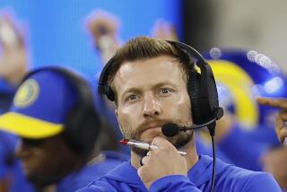 Rams head coach Sean McVay walks the sidelines in thought against the Saints.