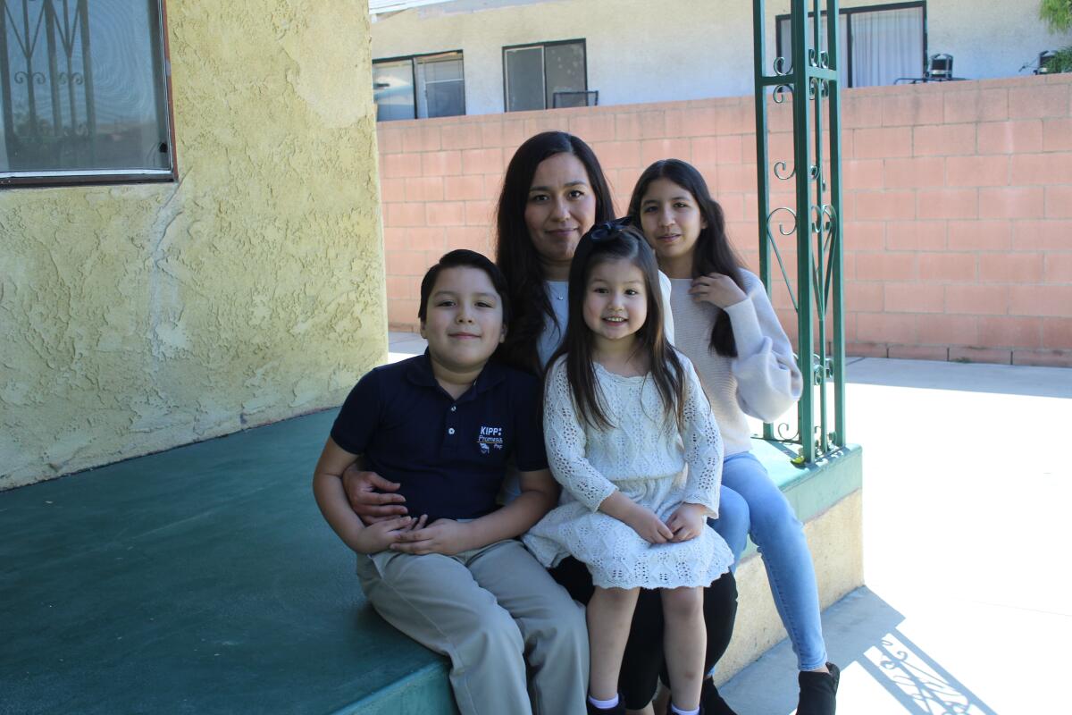 Óscar Pérez II, left, with his mother, Yuri Martínez Pérez, sister Isabella, 4, and sister Kimberly, 13.